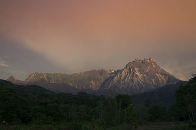 Scenic view of mountains against sky during sunset