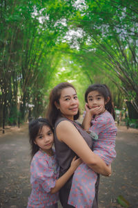 Family in bamboo tunnel of wat chulabhorn wanaram temple