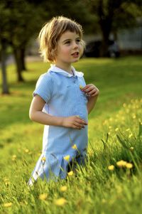 Girl standing on field