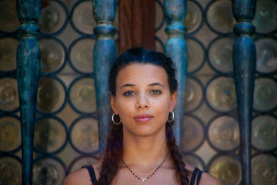 Portrait of beautiful young woman standing outdoors