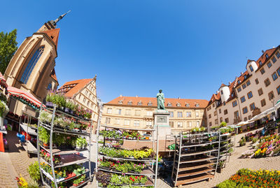 Low angle view of buildings against clear blue sky