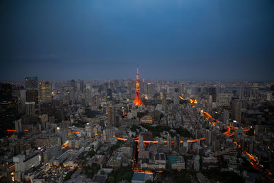 Aerial view of city buildings at dusk