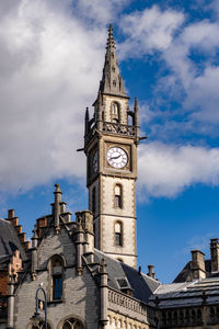 Low angle view of clock tower against sky