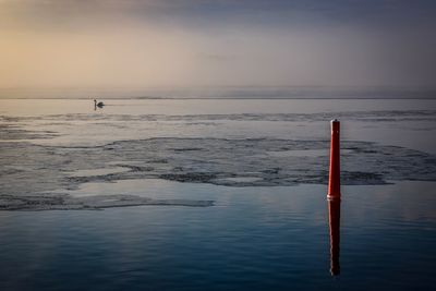 Scenic view of beach against sky during sunset