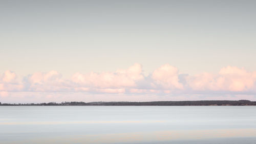 Scenic view of sea against sky at sunset