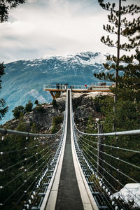 Panoramic view of bridge and mountains against sky