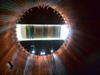 Low angle view of illuminated tunnel