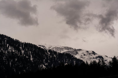 Low angle view of mountain against sky during sunset