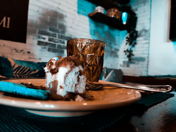 A piece of cake  in plate on table