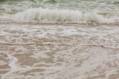 Waves splashing on beach