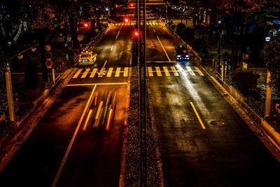 High angle view of light trails on road at night