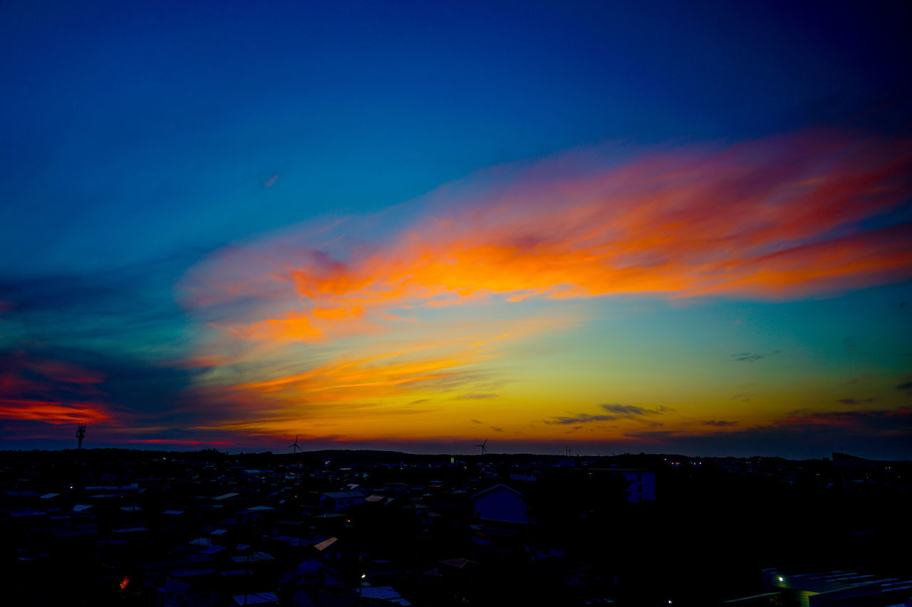 sky, cloud, horizon, afterglow, sunset, beauty in nature, nature, city, scenics - nature, dawn, no people, dramatic sky, evening, orange color, architecture, multi colored, landscape, tranquility, environment, cityscape, outdoors, building exterior, blue, red sky at morning, night, tranquil scene, idyllic, silhouette, sea, built structure