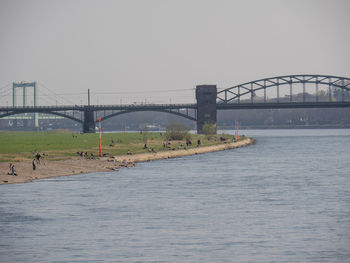 Bridge over river against clear sky