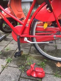 High angle view of red bicycle on street in city