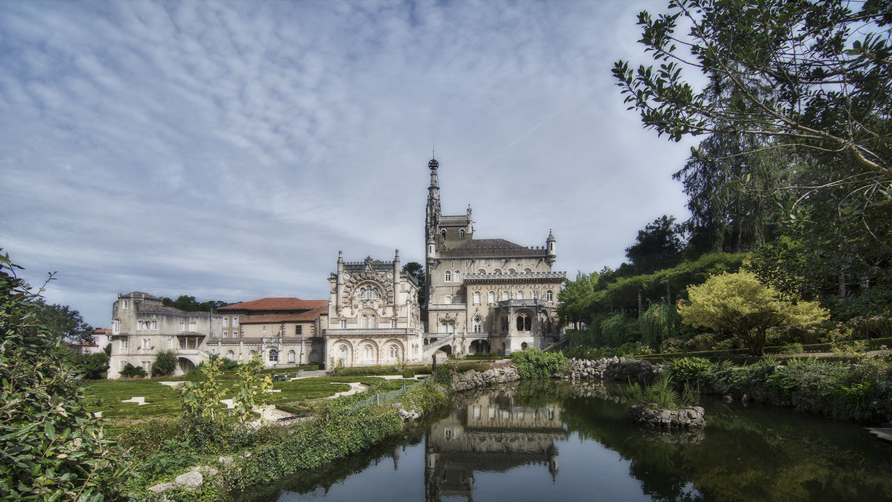 architecture, built structure, building exterior, tree, history, sky, travel destinations, water, reflection, no people, place of worship, religion, tourism, travel, spirituality, cloud - sky, day, outdoors, nature