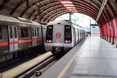 Delhi metro train arriving at jhandewalan metro station in new delhi, india,asia, public metro train