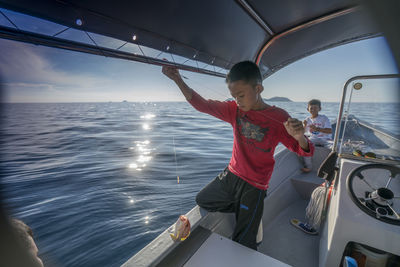 Tourist on boat sailing in sea