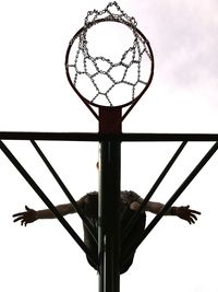 Low angle view of basketball hoop against sky