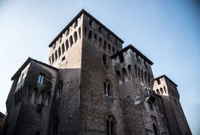 Low angle view of old building against clear sky