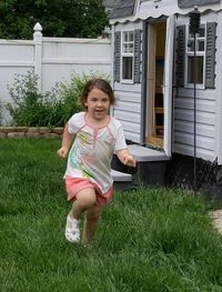 Portrait of happy girl relaxing on lawn