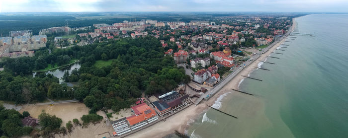 High angle view of townscape by river against buildings