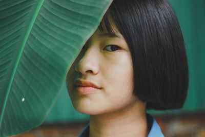 Close-up portrait of a woman looking away