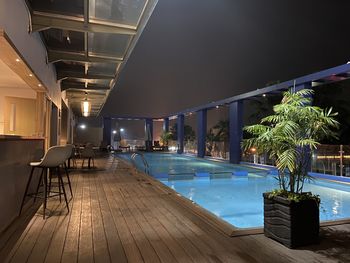 Illuminated swimming pool at night