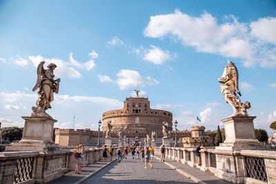 Statue of historical building against cloudy sky