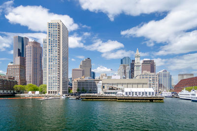 Modern buildings in city against sky