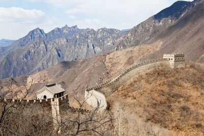 View of landscape with mountain range in background