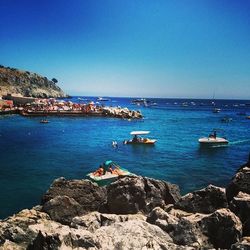 Scenic view of sea against blue sky