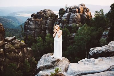 Man standing on rock formation