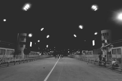 Street lights in illuminated city at night