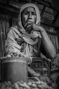 Portrait of woman selling food at market