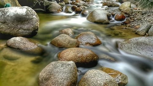 Close-up of pebbles on shore