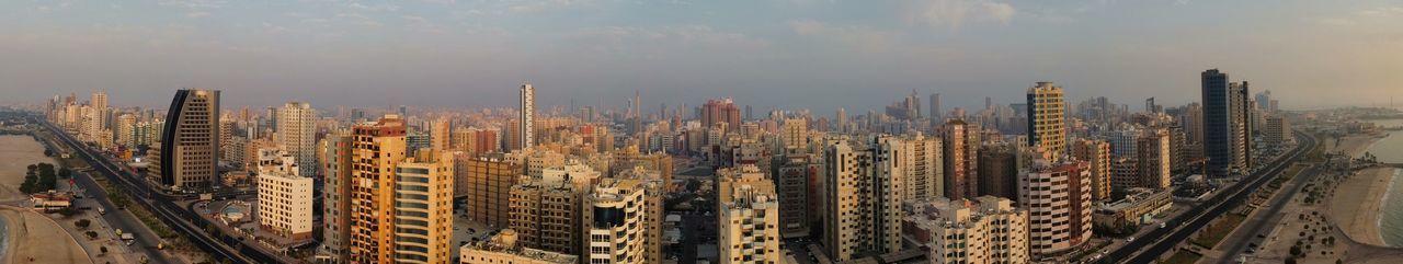 High angle view of modern buildings in city against sky