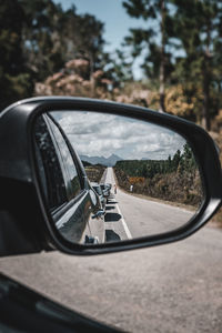 Reflection of car on side-view mirror