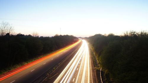 High angle view of light trails on road in city