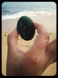 Cropped image of man on beach