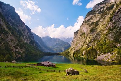 Scenic view of lake and mountains against sky