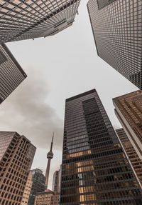 Low angle view of tall buildings against sky