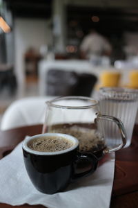 Close-up of coffee served on table