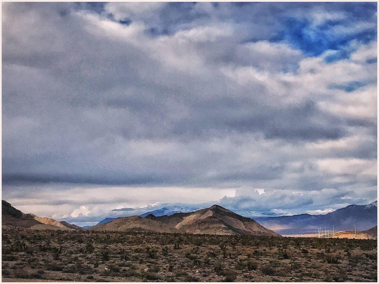 SCENIC VIEW OF MOUNTAIN AGAINST SKY