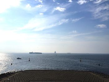 Scenic view of sea against cloudy sky