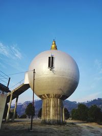 View of bell tower against blue sky