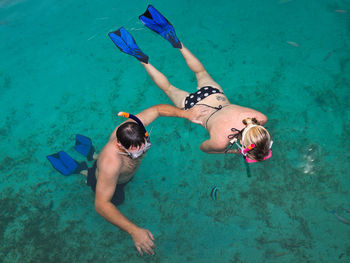 High angle view of man swimming in sea