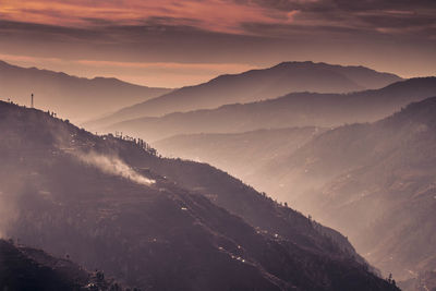 Scenic view of mountains against dramatic sky