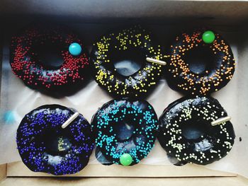 Close-up of multi colored candies on table