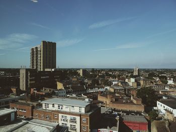 High angle view of buildings in city against sky