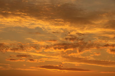 Low angle view of dramatic sky during sunset